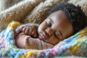 A peaceful sleeping baby boy wrapped in a colorful blanket, exuding warmth and tranquility. photo