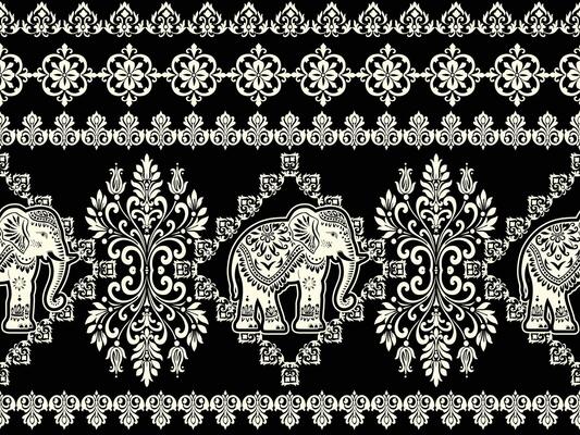 an ornate black and white pattern with elephants