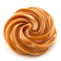 A swirl of smooth, golden caramel sauce on a clean white background. photo