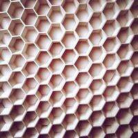 A close up of a wall with hexagonal shapes photo