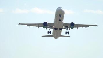 An airplane taking off, lifting off into the sky as its landing gear retracts smoothly into the fuselage, marking the beginning of its flight. video