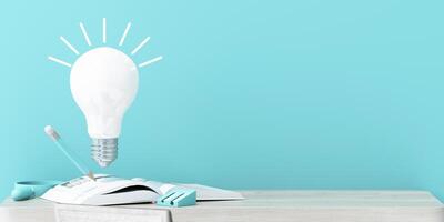 A floating light bulb symbolizes creativity above an open book with a pencil, on a minimal wooden desk with blue accents, evoking inspiration and learning. 3d rendering. photo