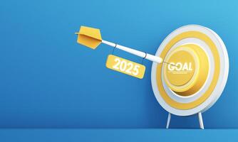 A dart labeled 2025 hits the center of a yellow target marked GOAL, symbolizing success and future achievements. The blue background enhances the focus on determination. 3d rendering. photo