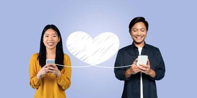A joyful couple connects on St. Valentine's Day, smiling as they send loving messages via their smartphones. Their affection shines through as they engage in this online celebration of love. photo