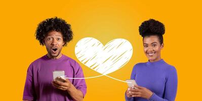 A couple expresses their affection on St. Valentine's Day, happily engaging with each other through smartphones. They share loving messages, emphasizing their connection and joy. photo