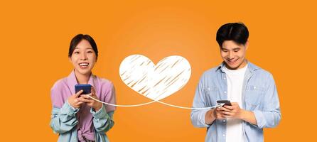 A loving couple engages in affectionate communication on St. Valentine's Day, using their smartphones to connect through heartfelt messages on an online application against a vibrant background. photo