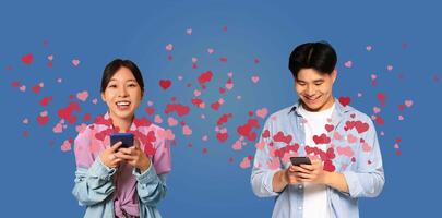 Two people share a joyful moment on St. Valentines Day while using their smartphones. They exchange affectionate messages filled with hearts, celebrating their love and connection. photo