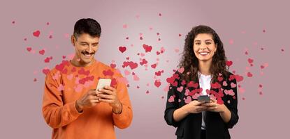 A couple shares affectionate messages on their smartphones while surrounded by floating heart graphics. They are celebrating Valentine's Day together in a cozy, isolated setting. photo