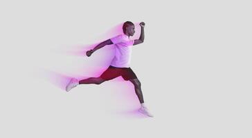 Dynamic image of an African American man captured in a mid-air running pose against a stark grey background, illustrating motion and athleticism photo