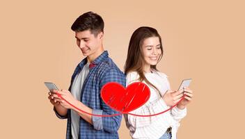 A couple joyfully engages with their smartphones, sharing affectionate messages on Valentine's Day. They stand side by side, immersed in their online connection, embodying love and togetherness. photo