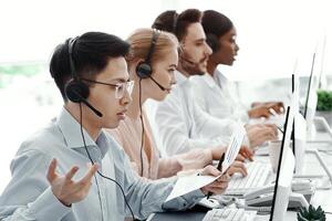 Frustrated hotline operator dealing with customer problem in call centre office photo