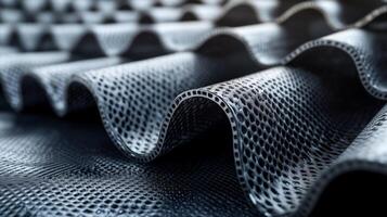 Close-up view of a textured industrial material with waves, depicting intricate designs used in manufacturing processes such as welding or casting. photo