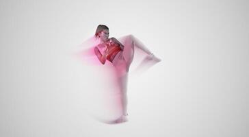 Lady trainer showing kick exercise for self defense by legs on studio background, copy space. African american woman training in sportswear in studio photo