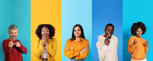 A diverse group of happy individuals is posing against a vibrant, multicolored backdrop. They are engaging in fun expressions and showcasing their unique personalities. photo
