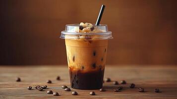 A delicious iced coffee sits on a wooden table, showcasing layers of cream and coffee topped with crunchy elements. Coffee beans are scattered around, highlighting the drink. photo