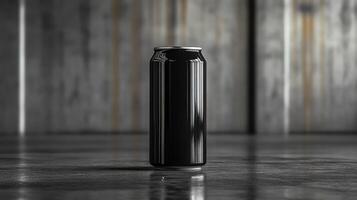 A sleek black can stands upright on a polished floor. The background features industrial elements with a textured finish, enhancing the minimalist aesthetic. The lighting adds depth to the scene. photo