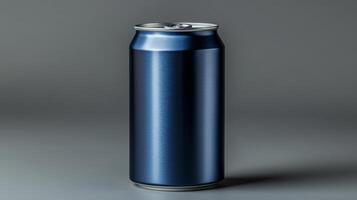 A metallic blue beverage can stands upright on a smooth gray surface, illuminated by soft lighting that highlights its sleek design and finish, reflecting a modern aesthetic. photo