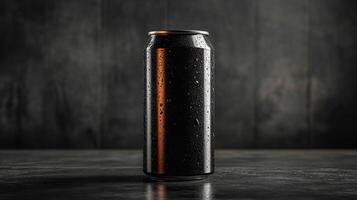 A sleek black can stands on a textured surface, covered in moisture droplets. The background is shadowy, enhancing the can's bold design and texture in this minimalistic setup. photo