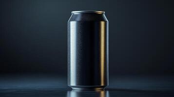 A black aluminum can stands upright on a reflective surface, spotlighted by a soft glow from above. The design showcases simplicity and elegance with no labeling or branding. photo