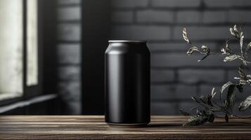 A black beverage can stands on a rustic wooden table beside delicate plants, bathed in soft light from a nearby window, suggesting a cozy atmosphere. photo