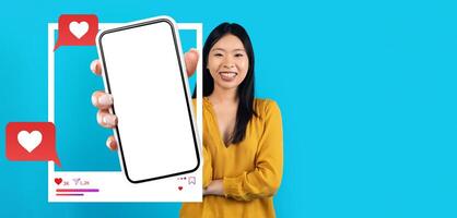 A blogger holds a smartphone displaying a blank screen, ready for a social media post. photo