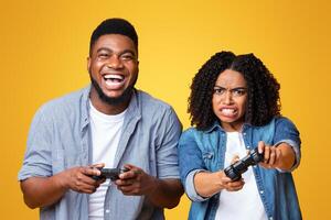 Two friends sit side by side, joyfully competing in a game while holding controllers. Their contrasting expressions reflect excitement and determination during the game. photo