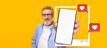 An influencer presents a smartphone featuring a blank screen against a bright yellow background. The person engages with social media, symbolizing online connection and communication. photo