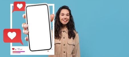 An influencer enthusiastically displays a smartphone against a bright blue background. Heart icons and chat bubbles suggest the excitement of online interactions and social networking. photo