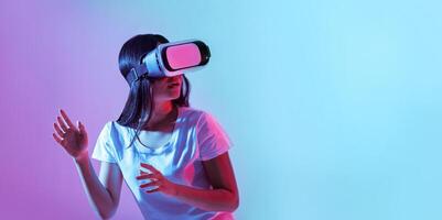 A young woman immerses herself in a virtual reality session, wearing a headset and reacting actively. Background features vibrant colors, creating an engaging atmosphere for exploration, copy space photo