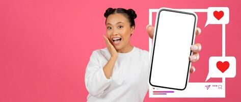 An influencer happily displays her smartphone with a blank screen, surrounded by floating hearts and chat bubbles, highlighting her excitement for online interaction and social media engagement. photo