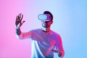 A person explores a virtual reality experience, wearing a headset while interacting with their surroundings. The vibrant pink and blue lights create an immersive atmosphere. photo
