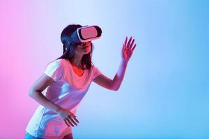 A woman engages with virtual reality, wearing a headset and exploring an immersive digital environment. Bright pink and blue lights enhance the captivating atmosphere of the tech event. photo