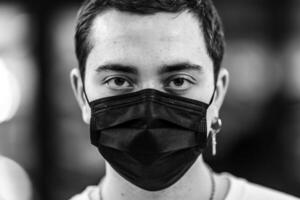 Portrait of a man in a mask from a virus. photo