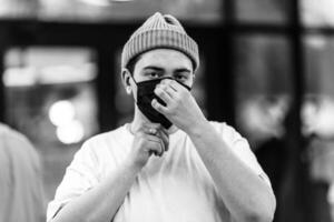 A man puts on a mask from a virus. Flu epidemic. photo