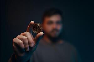 Man holding bitcoin. Financial ecosystem. The currency of the future. photo