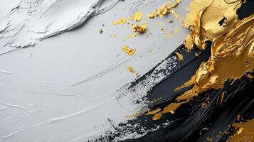 Gold and black paint on a white background photo