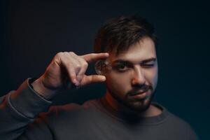 Man holding bitcoin. Cryptocurrency in hand. photo