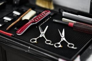 Tools for grooming prepared on a work surface in a barbershop setting photo