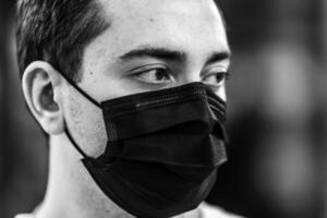 Portrait of a man in a mask from a virus. photo