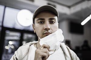 A man puts on a mask from a virus. Flu epidemic. photo