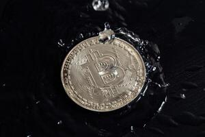 Cryptocurrency coins on a dark background. Rain drops on coins. photo