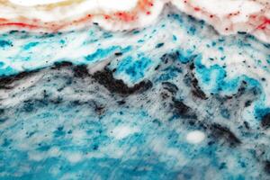Macro world and texture of liquid with the addition of paint. photo