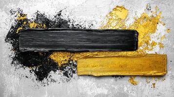 Black and gold paint on a grungy wall photo