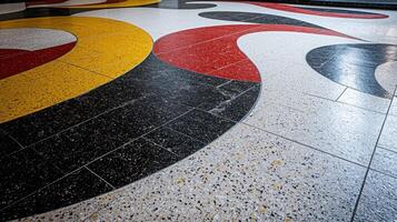 A floor with a black, red, and yellow design photo
