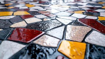 A mosaic tile floor with a wet surface photo