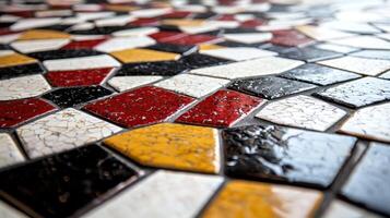 A mosaic tile floor with a black, white, and red design photo