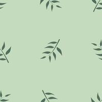A green leaf pattern on a light green background vector