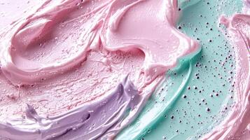 A colorful swirl of paint with pink, purple, and green hues photo