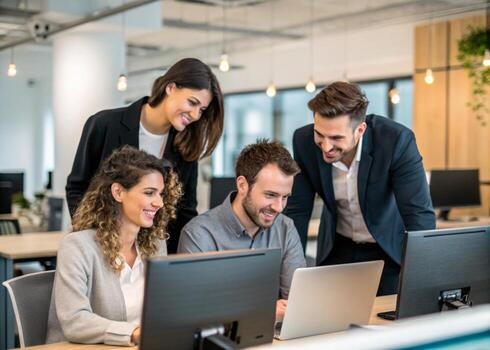 three business people working on computers in an office photo