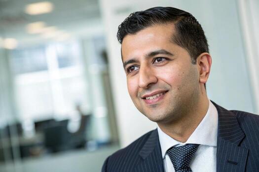 a man in a suit and tie smiling photo